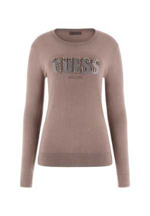 Maglione marrone con maniche lunghe, colletto e orlo a coste, con logo "GUESS" impreziosito da strass e "EST. 1981" in carattere più piccolo sottostante.