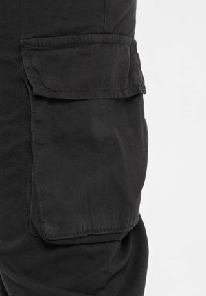 RUBY - Cargo trousers - black