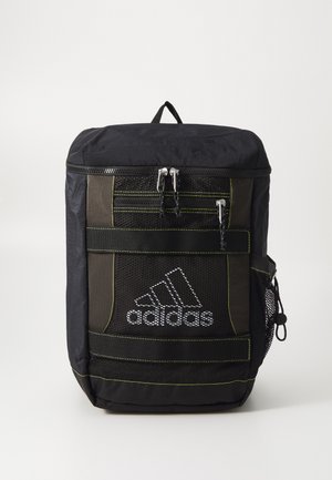 Black backpack with yellow accents, featuring a top zip closure, mesh front pockets, and the Adidas logo on the lower section.