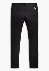 Black cotton chinos with a straight leg design, two back pockets with buttons, and a branded label near the waistline.