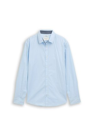 Helehall sinine pika varrukaga särk, tehtud puuvillast. Omab klassikalist kraed, ees nööpidega sulguvat osa ja peent tekstuuri. Hemm on ümardatud.