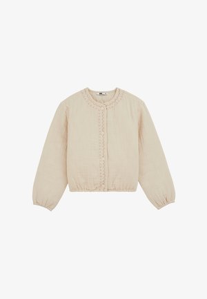 Veste longue beige à manches longues, matelassée, avec encolure ronde, fermeture par boutons-pression, poignets élastiques et détails discrets surpiqués le long des bords avant.