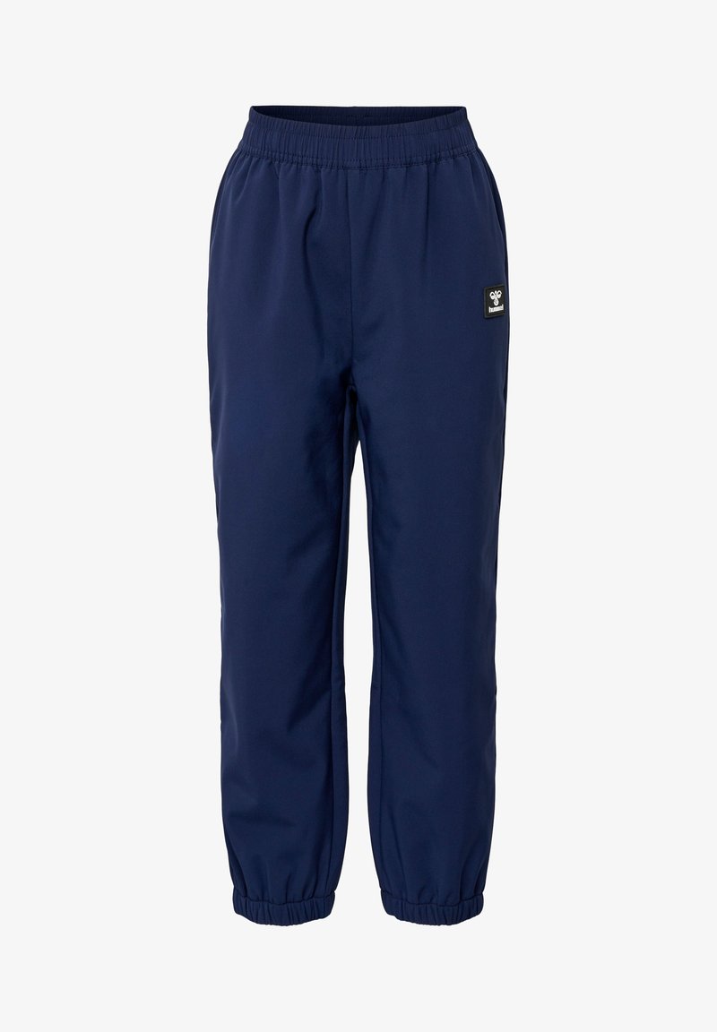 Navyblauwe sweatpants van gladde stof, met een elastische tailleband, gathered cuffs en een klein merklabel op één been.