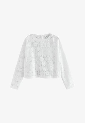 Witte blouse met lange mouwen met een zeshoekig kanten patroon en een ronde halslijn, met een kleine knoopsluiting aan de achterkant.