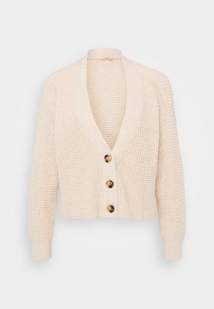 Beige knitted cardigan with a V-neck, long sleeves, and four rounded buttons in front. Textured fabric with ribbed cuffs and hem.