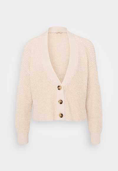 Beige knitted cardigan with a V-neck, long sleeves, and four rounded buttons in front. Textured fabric with ribbed cuffs and hem.