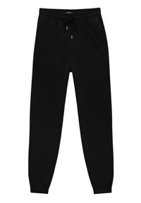 Svarta mjukisbyxor gjorda av mjukt tyg, med elastisk midja och snörning, sidofickor och smalnande muddar.