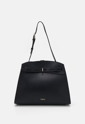 Black leather Furla handbag with adjustable shoulder strap and decorative front belt detail on a white background.