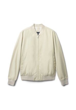 Giacca bomber beige chiaro con una texture liscia, polsini e colletto a coste, dotata di due tasche laterali e chiusura frontale con zip.