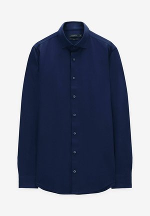 Granatowa koszula z długim rękawem, dopasowany krój, zapinana na guziki, gładki materiał, zaokrąglony dół i standardowy kołnierz z dopasowanymi guzikami.