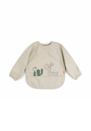 Smėlio spalvos ilgomis rankovėmis apsiaustas su elastingomis rankogalių dalimis. Priekyje yra žali kaktusai ir paprasti linijiniai paukščio bei lamos piešiniai.