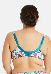 Soutien-gorge à motif floral en rose clair et bleu canard. Doté de bretelles réglables, d'une fermeture à crochets et œillets, et d'une texture lisse avec des motifs vibrants.