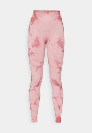 High-waisted leggings in pink with a marble pattern. Made from stretchy, smooth fabric with a fitted silhouette and seamless waistband.