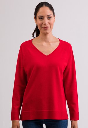 Czerwony sweter z dekoltem w serek, długim rękawem i ściągaczami. Miękka tkanina o luźnym kroju, charakteryzująca się gładką teksturą i jednolitym kolorem.