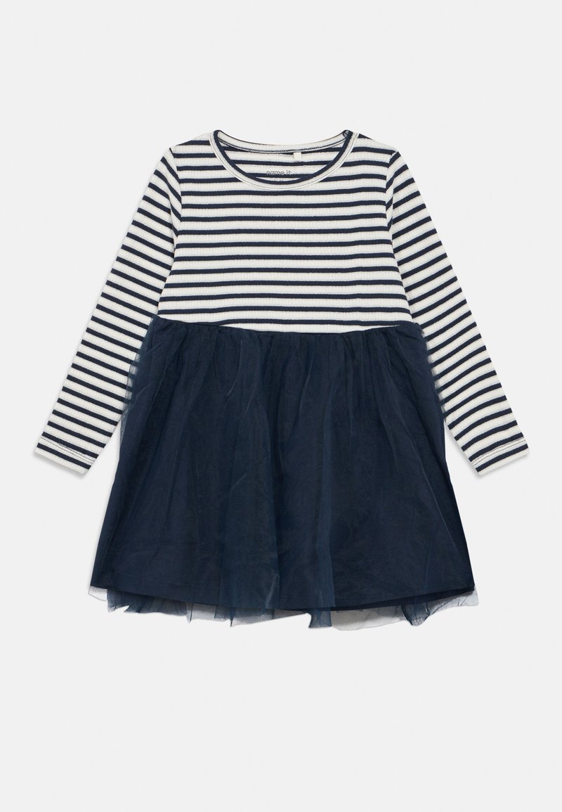 Φόρεμα με μακριά μανίκια, κορυφή με οριζόντιες λευκές και ναυτικές ρίγες και φούστα από τούλι σε ναυτικό μπλε χρώμα, ραμμένη στη μέση.