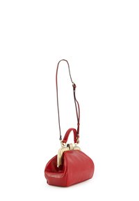 Red leather handbag with a rounded shape, featuring a gold clasp and a detachable shoulder strap. Textured surface with a smooth finish.