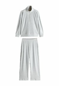 Helehall hallitusen komplekt, kus on lukuga kaelusega pullover ja laiad püksid, mõlemal on ribakujuline tekstuur ja küljetaskud.