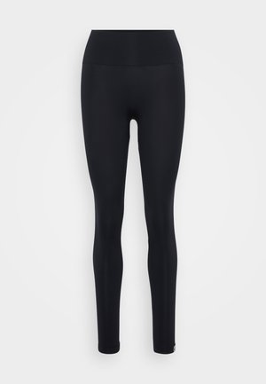 Black leggings with a high waistband, made of stretchy fabric. Design is form-fitting, seamless with no visible patterns or hardware details.
