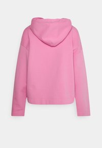 Felpa rosa con cappuccio, dalla vestibilità ampia, dotata di tasca a marsupio e polsini a costine. Tessuto morbido, superficie liscia e design a tinta unita.
