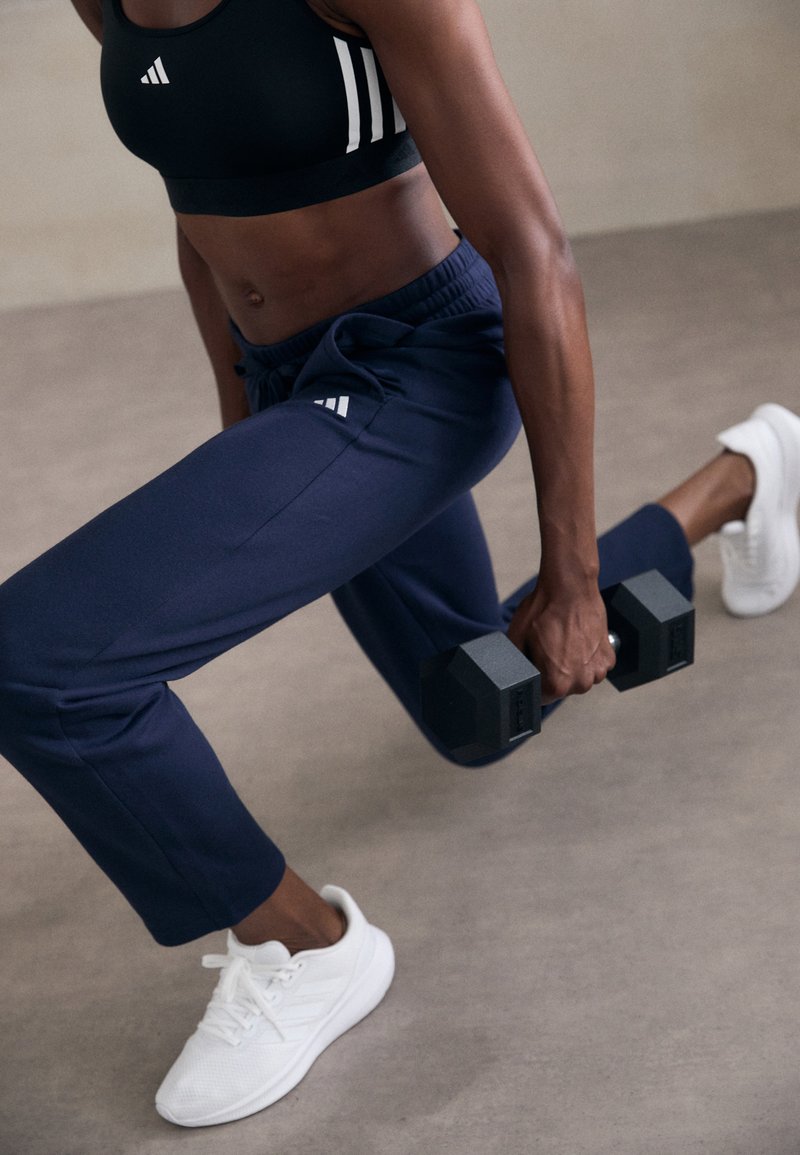 adidas Sportswear ESSENTIALS SMALL LOGO FEEL COZY OPEN HEM PANT - Calças de fato de treino - legend ink