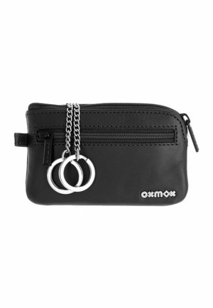 Black leather pouch with front zipper, two silver key rings on chains, and "oxmox" logo on bottom right corner.