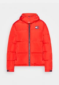 Red puffer jacket with a hood, featuring a front zip closure, side pockets, and a logo patch on the upper left chest. Smooth texture.