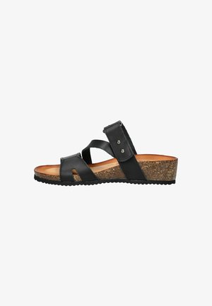 Sandal in pelle nera con suola in sughero. Presenta multiple cinghie, ritagli e una chiusura con fibbia con dettagli in metallo argentato.