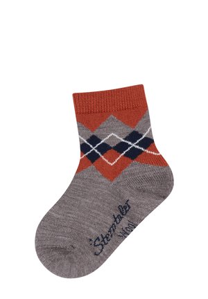 Child-sized gray sock with orange cuff, orange and navy argyle pattern, and navy text near the toe reading "Sterntaler."
