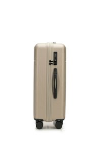 Hard-shell suitcase in metallic champagne color, featuring a textured surface, black zipper with combination lock, and four black wheels for mobility.