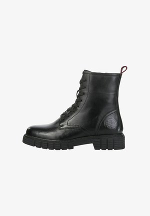 Stivale alla caviglia in pelle nera con lacci frontali, punta arrotondata, suola in gomma texturizzata e un cappio sul retro. Presenta un marchio discreto sul lato.