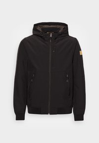 Giacca nera con zip e cappuccio, dotata di tasca sul petto con zip, due tasche laterali e polsini elasticizzati. Tessuto liscio con texture minimale.