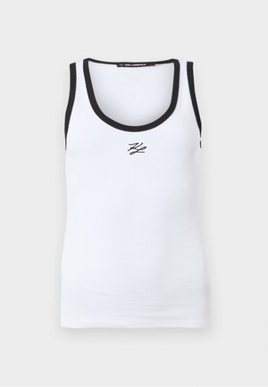 White ribbed tank top with black trim on neckline and armholes, featuring a small black "KL" logo centered below the neckline.