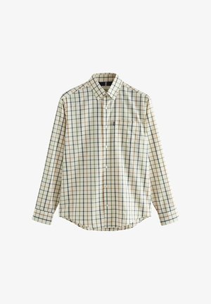 Kreemivärvi pikkidega, millel on tume roheline, tumesinine ja oranž ruuduline muster, pika varrukaga nööpkrae särk. Omab kraed ja rinna taskut.