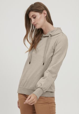 Kapuzensweatshirt in hellem Beige, aus weichem Stoff gefertigt. Mit Kordelzügen, gerippten Bündchen und einem lockeren Schnitt. Flache Nähte und ohne Muster.