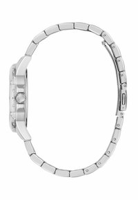 Montre-bracelet en argent vue de côté, présentant un boîtier rectangulaire avec une finition polie et un bracelet en métal lissé.