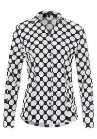 Camicia a maniche lunghe in cotone, con sfondo blu navy e grandi pois bianchi, colletto e chiusura con bottoni.
