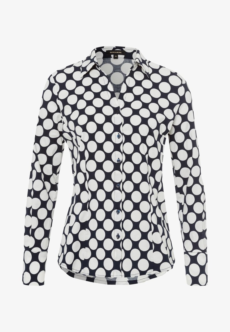 Long-sleeve shirt made of cotton, featuring a navy background with large white polka dots, a collared neckline, and button-up front.