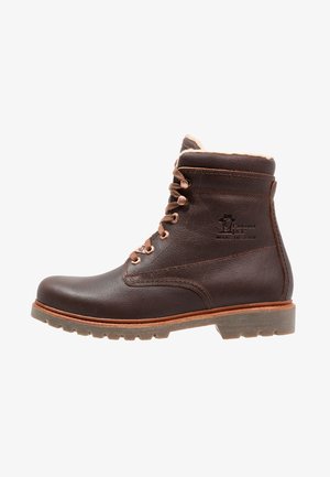 Brown leather ankle boot with a lace-up design, featuring a soft fur lining, rubber outsole, and stitched detailing. Logo embossed on side.
