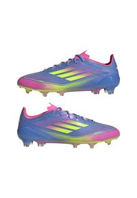 Blue and pink football cleats with a textured synthetic upper, featuring neon green accents and a sleek, streamlined design for performance.