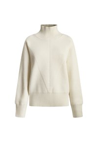 Krämfärgad rippad polotröja med en triangulär design framtill, långa ärmar och en åtsittande nederkant. Mjuk textur, avslappnad design.