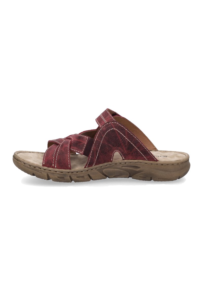 Red leather slide sandal with cross-strap design, textured surface, brown sole, and white stitching. Open toe and slip-on style.