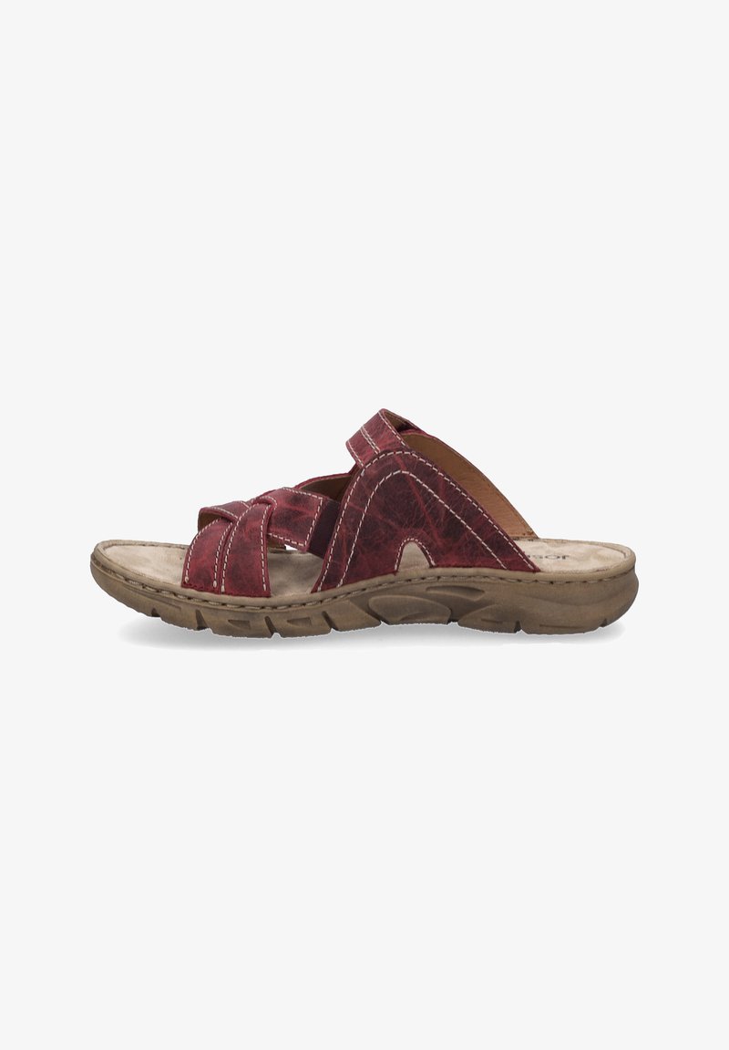 Red leather slide sandal with cross-strap design, textured surface, brown sole, and white stitching. Open toe and slip-on style.