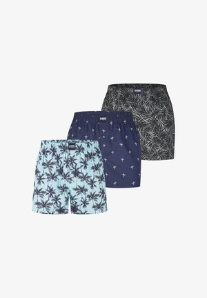 Drei Paar Herren-Boxershorts mit tropischen Blatt- und Palmenmustern in Blau-, Navy- und Schwarztönen, nebeneinander gezeigt.