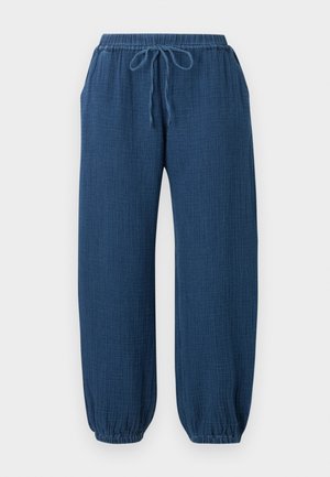 Μπλε υφασμάτινο παντελόνι για χαλάρωση με ελαστική μέση, κορδόνι, πλαϊνές τσέπες και ελαστικά μανσέτες μαζεμένες.