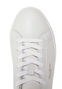 White leather sneaker with round toe, flat white laces, subtle stitching details, and a gold logo on the side. Smooth texture and minimal design.