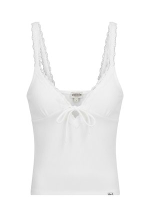 Canottiera bianca a coste con spalline rifinite in pizzo, piccolo fiocco frontale e etichetta "Guess Jeans" sullo scollo.