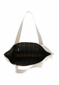 Borsa tote color beige chiaro con chiusura a zip, spallacci in tessuto e interno a patterned nero con una piccola tasca con zip.
