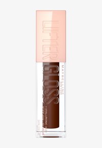 Le gloss Lifter de Maybelline dans un tube transparent avec un gloss brun à l'intérieur. Le capuchon rose doré présente un texte en relief inscrivant "LIFTER GLOSS."