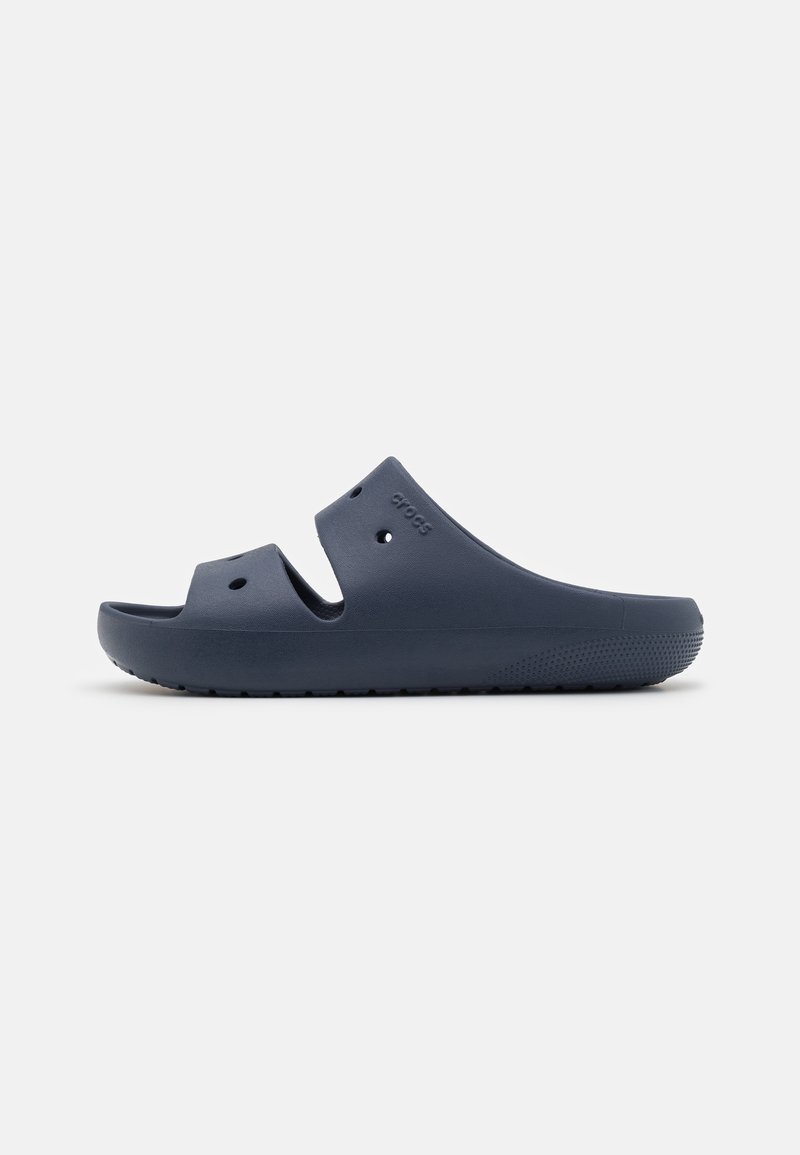 Navy blue slip-on sandals made of lightweight rubber with open toes, side cutouts for ventilation, and textured soles for grip.