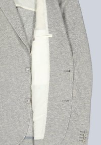 Gray textured blazer with light inner lining, two front buttons, and three-button cuffs. Features tailored lapels and breast pocket.